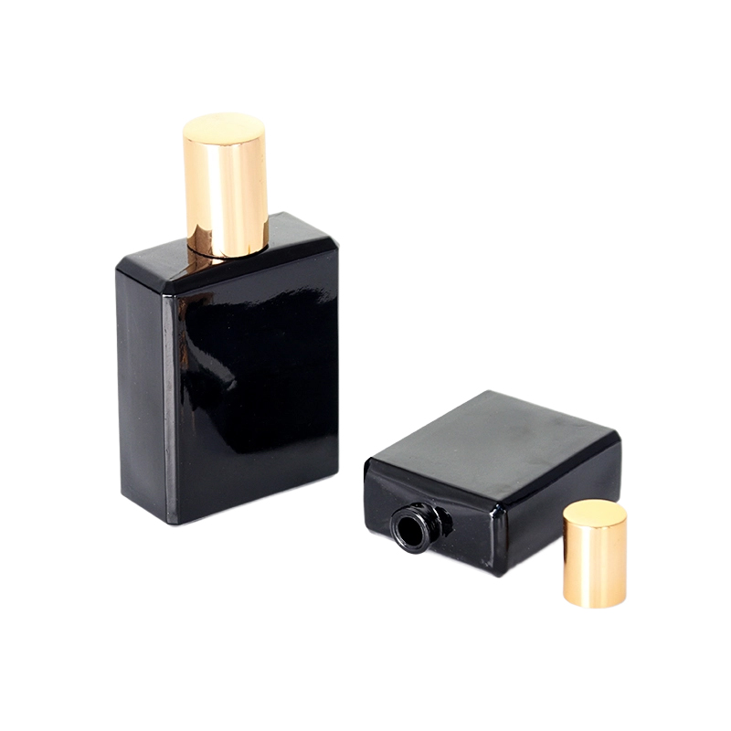 Frasco de perfume feminino preto retangular com tampa dourada